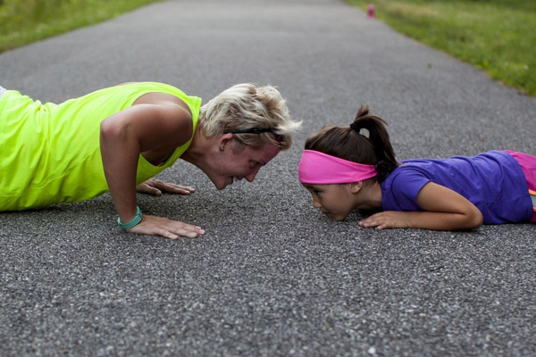 A-woman-and-a-girl-makeing-sport-together A-woman-and-a-girl-makeing-sport-together
